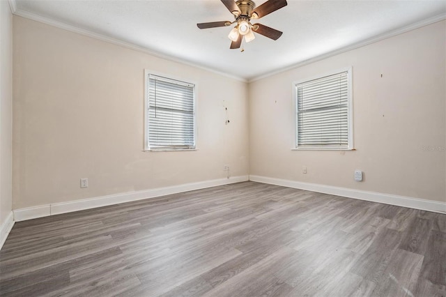 unfurnished room with ceiling fan, ornamental molding, and hardwood / wood-style flooring