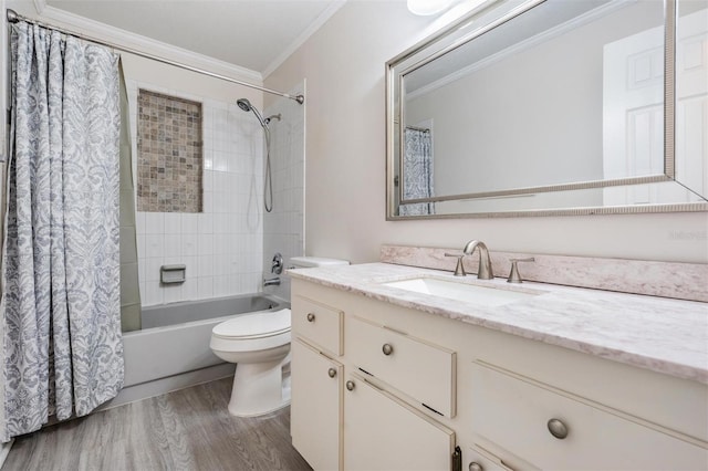 full bathroom featuring wood-type flooring, vanity, shower / bath combination with curtain, toilet, and ornamental molding