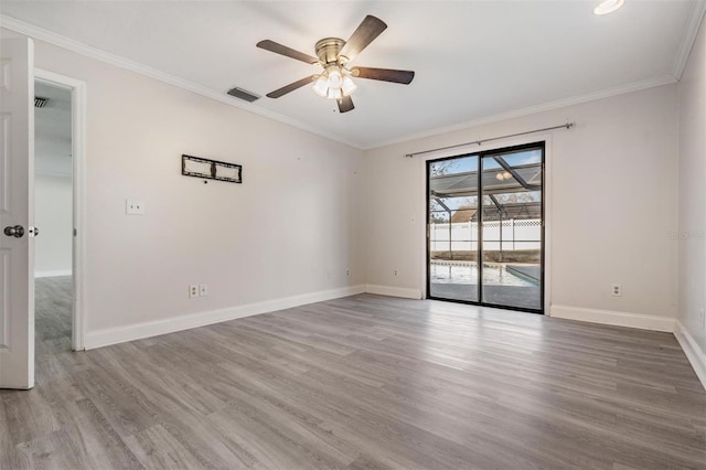 unfurnished room with ceiling fan, hardwood / wood-style flooring, and ornamental molding