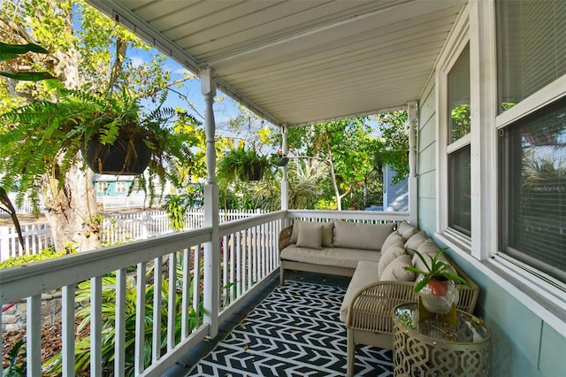 balcony featuring a porch