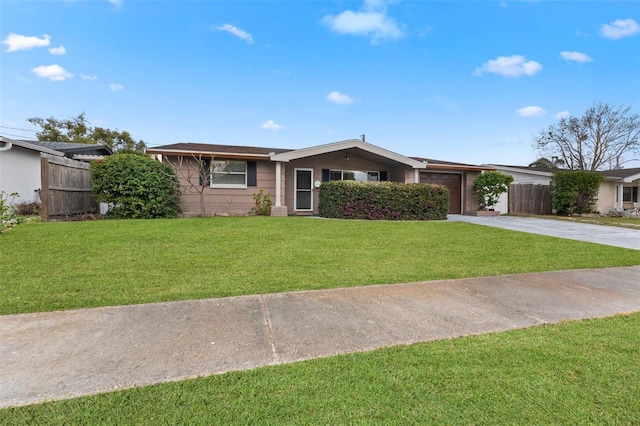 ranch-style home featuring a garage and a front yard