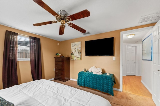 carpeted bedroom with ceiling fan