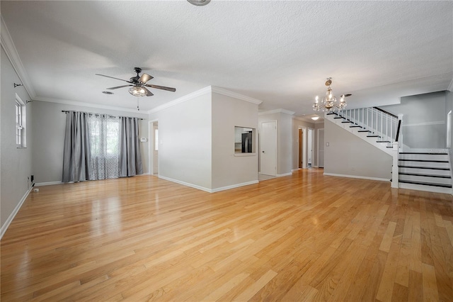 unfurnished living room featuring ornamental molding, ceiling fan with notable chandelier, a textured ceiling, and light hardwood / wood-style floors