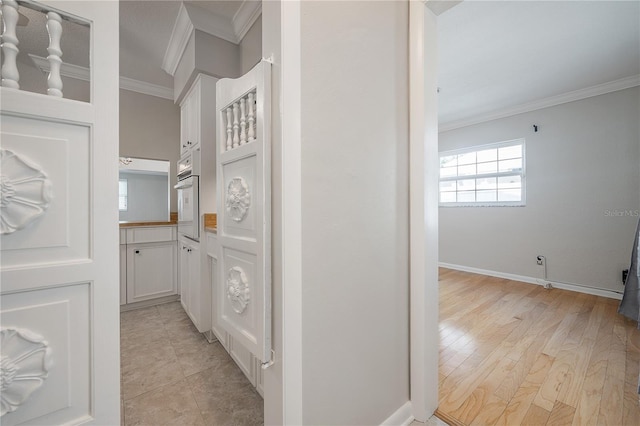 interior space featuring crown molding and hardwood / wood-style flooring