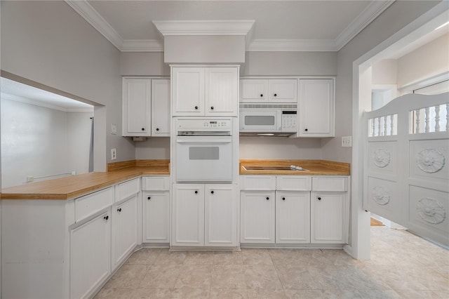 kitchen featuring white cabinetry, white appliances, and crown molding