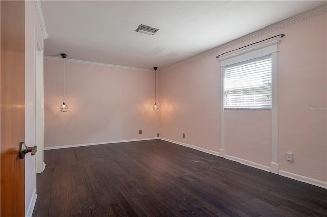 empty room with ornamental molding and dark hardwood / wood-style floors