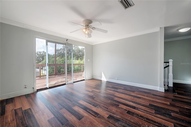 spare room featuring ornamental molding, dark hardwood / wood-style floors, and ceiling fan