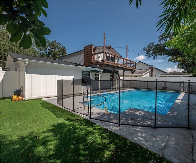 view of swimming pool with a patio and a lawn