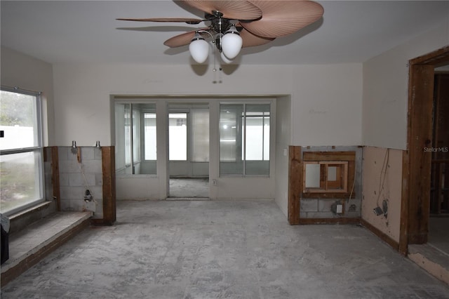 interior space featuring ceiling fan