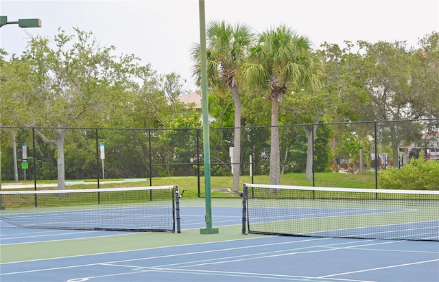 view of sport court with basketball hoop