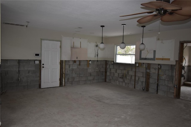 basement featuring ceiling fan