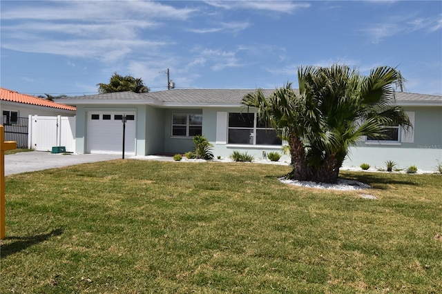 123 9th St, Belleair Beach, FL 33786 - ranch-style house featuring stucco siding, driveway, a front yard, and a garage
