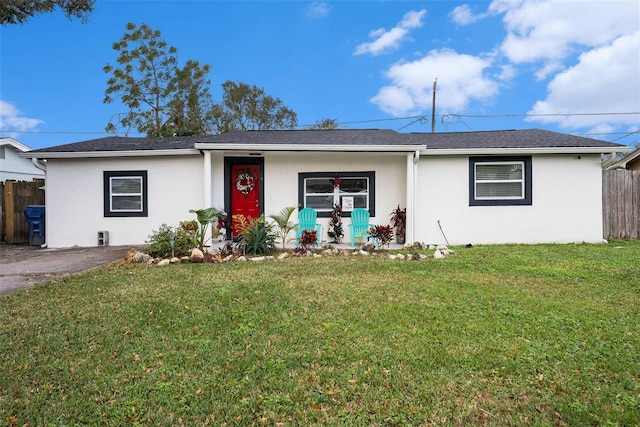 ranch-style house featuring a front lawn and a porch