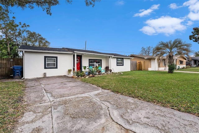 single story home featuring a front lawn