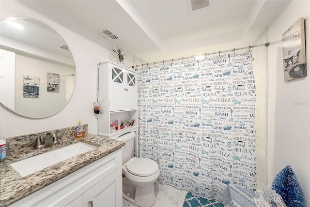 bathroom with vanity, a shower with shower curtain, and toilet