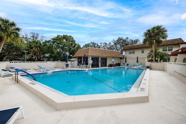 view of pool with a patio area and an outdoor structure