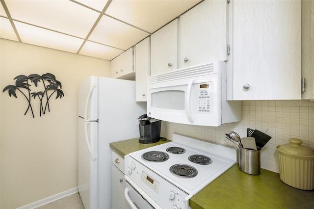 kitchen with backsplash, white cabinetry, a drop ceiling, and white appliances