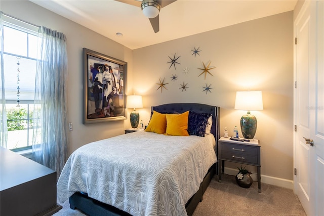 carpeted bedroom with ceiling fan