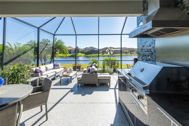 view of patio featuring area for grilling, an outdoor living space, a water view, glass enclosure, and a grill