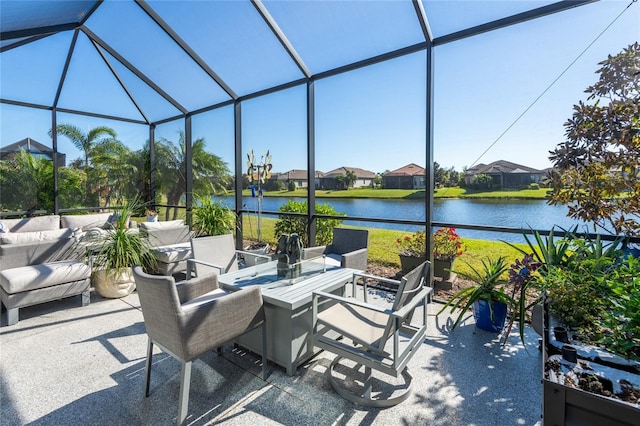 view of patio / terrace featuring outdoor lounge area, a water view, and a lanai