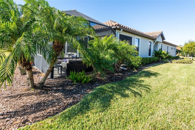 view of home's exterior featuring a yard