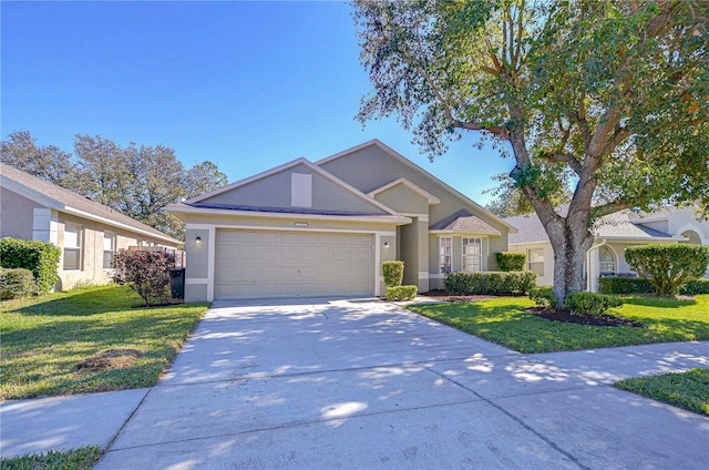 view of front of house featuring a garage and a front lawn