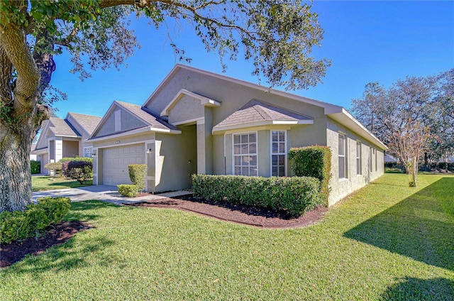 view of front of property featuring a garage and a front lawn