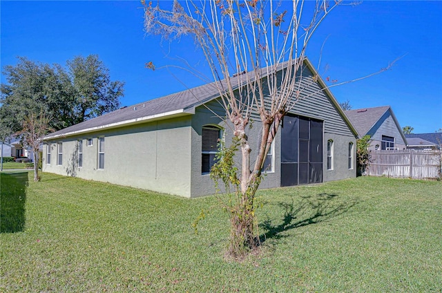 view of home's exterior with a yard