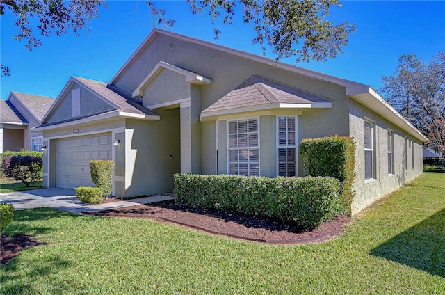 view of front of home with a garage and a front lawn