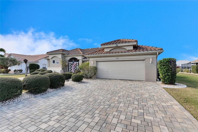 mediterranean / spanish-style house featuring a garage