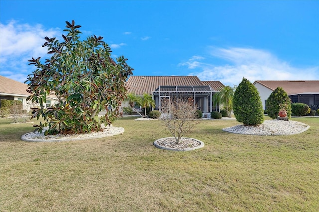 view of yard featuring glass enclosure