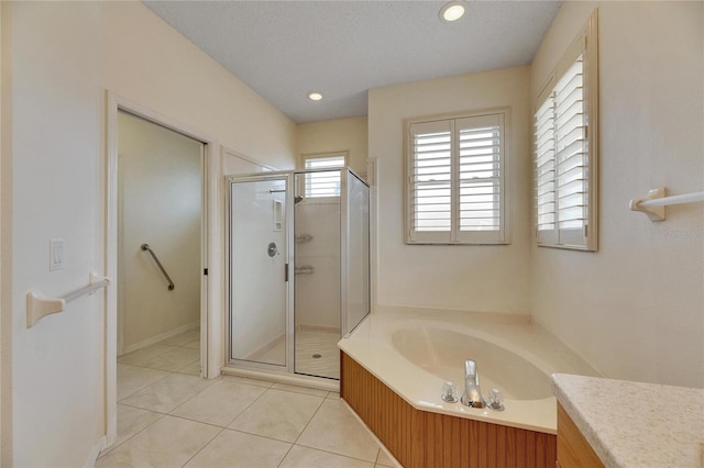 bathroom featuring tile patterned floors, vanity, and plus walk in shower