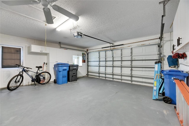 garage featuring a garage door opener and ceiling fan