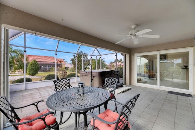 sunroom featuring ceiling fan