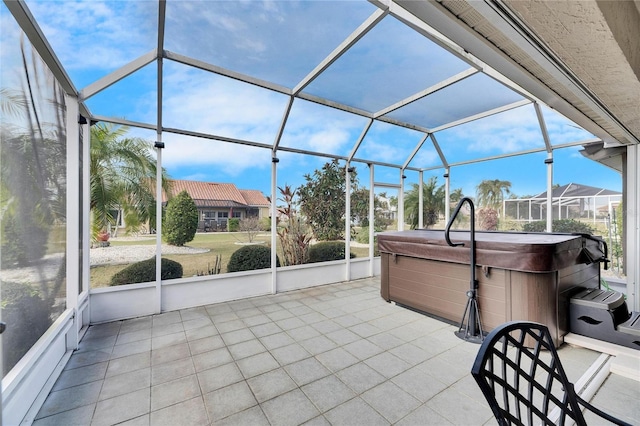 unfurnished sunroom with a jacuzzi