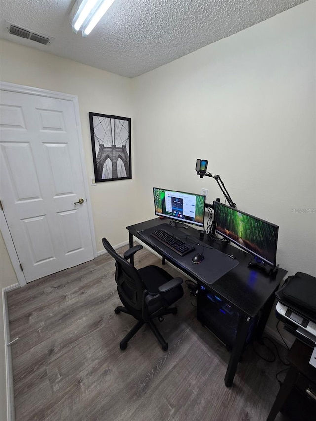 office area featuring a textured ceiling and hardwood / wood-style floors