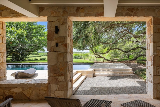 doorway to outside with a water view