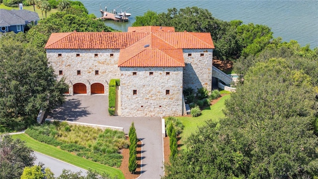 birds eye view of property with a water view