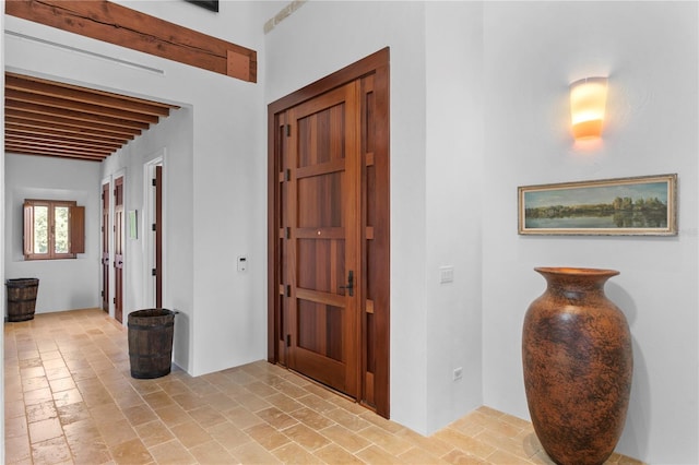 entryway with beam ceiling