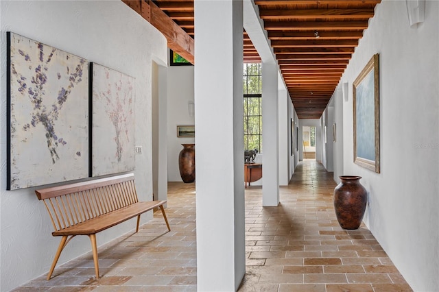 corridor featuring beamed ceiling