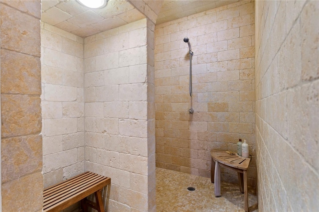 bathroom with a tile shower