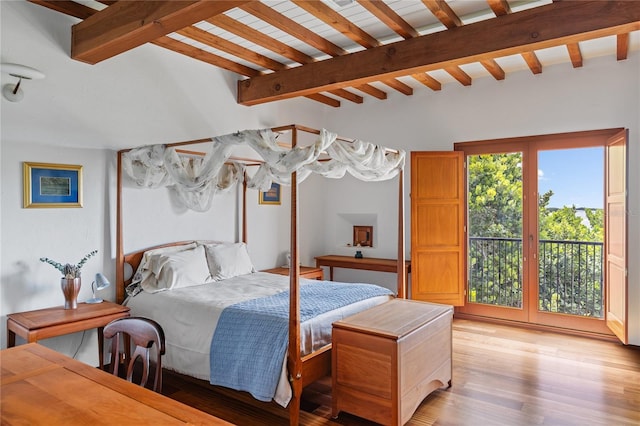 bedroom featuring beam ceiling, light wood-type flooring, and access to outside