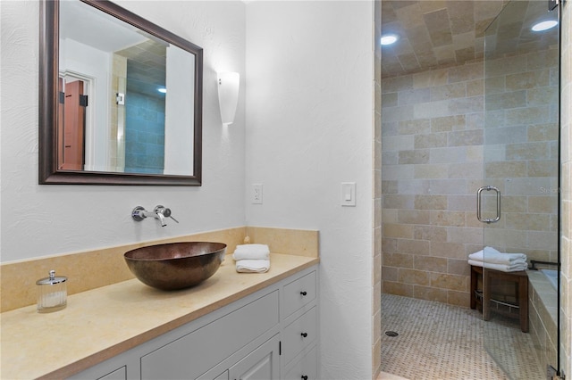 bathroom featuring vanity and walk in shower