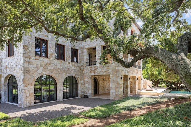 rear view of house featuring a patio area