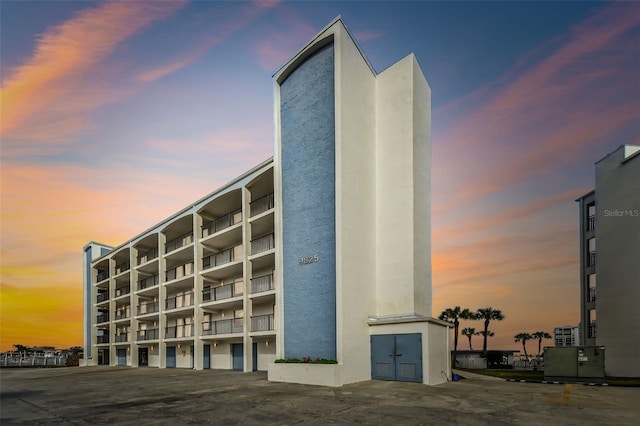 view of outdoor building at dusk