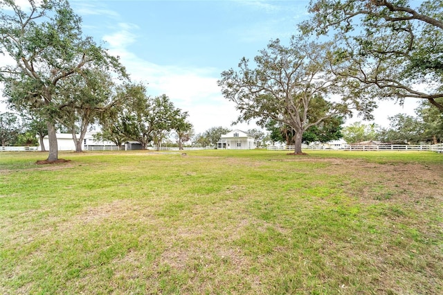 view of yard with a rural view