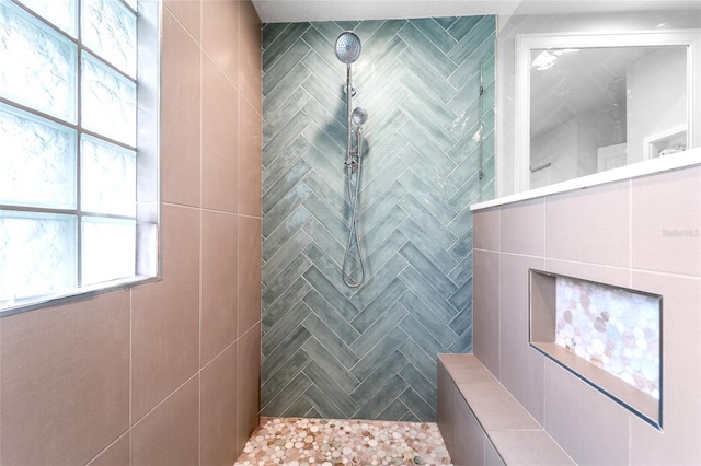 bathroom with tiled shower