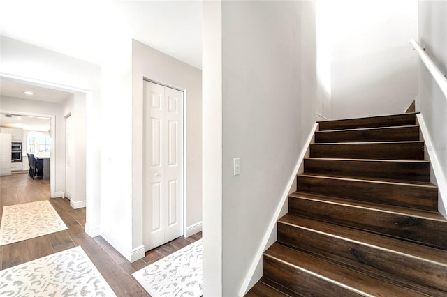 staircase featuring hardwood / wood-style floors