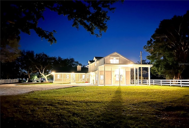 view of front of property with a lawn