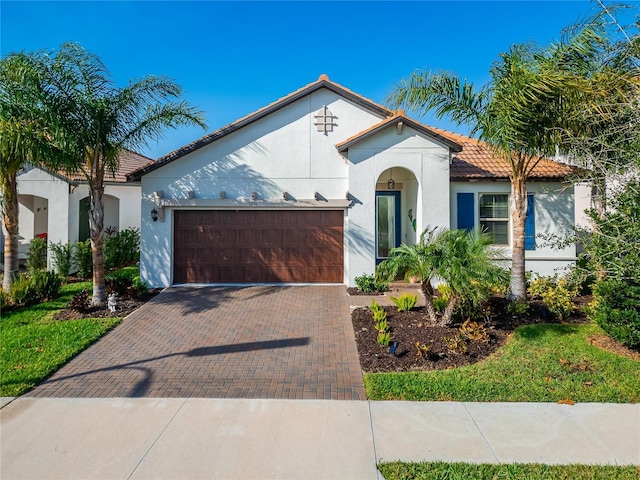 mediterranean / spanish-style home featuring a garage